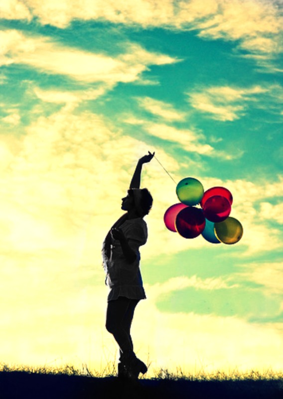 Girl holding balloons! (: