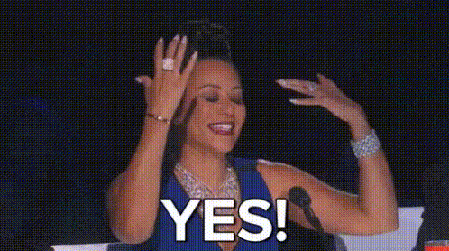lady waving arms saying YES!